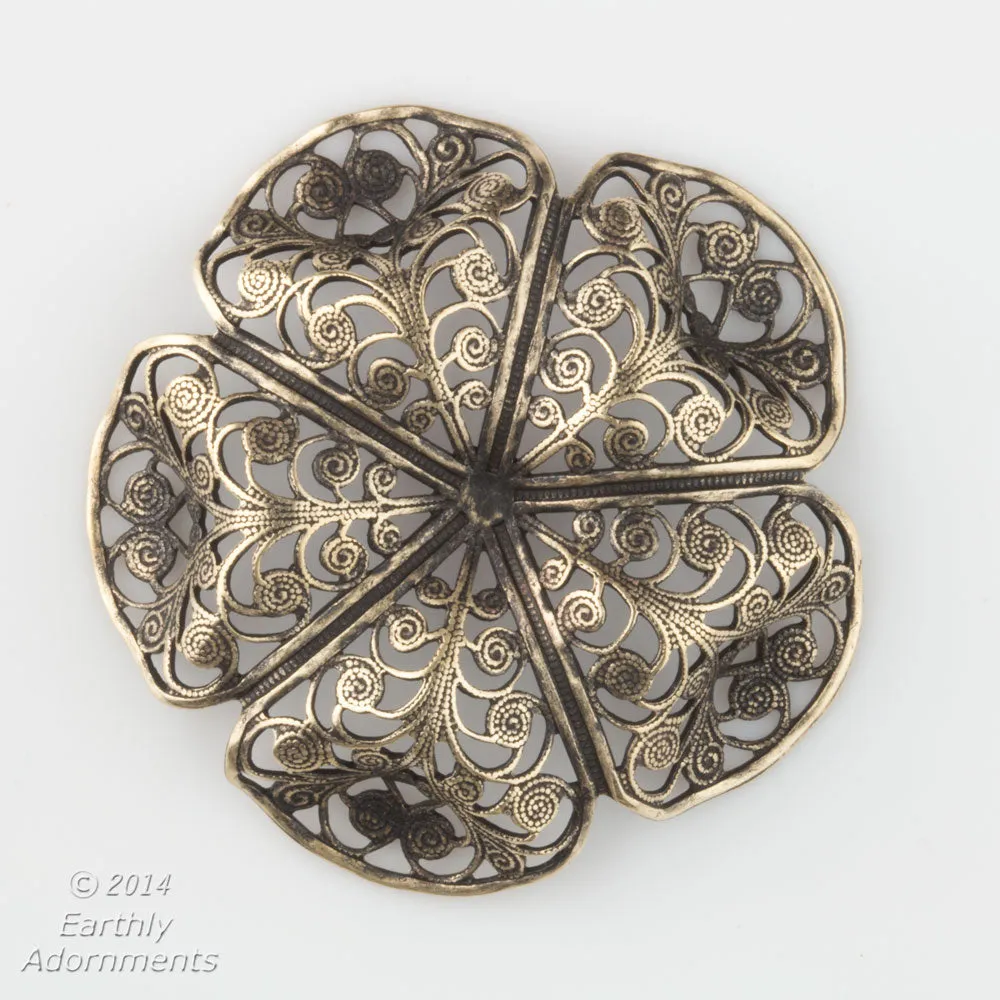 Oxidized brass filigree in a buttercup shape. 45x15mm Sold individually. b9-0575(e)
