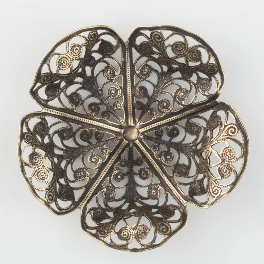Oxidized brass filigree in a buttercup shape. 45x15mm Sold individually. b9-0575(e)